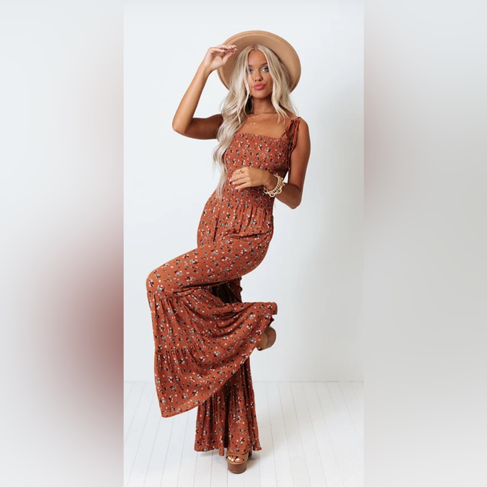 All smiles in soho jumpsuit in rust.